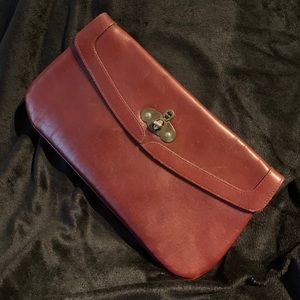 - Etienne Aigner handmade leather clutch